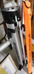 A laser level with theodolite style metal stand.