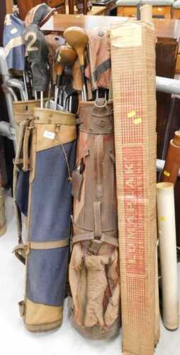 Various vintage golf clubs, golf bags, wooden headed spoon two wood, a quantity of other mid to...