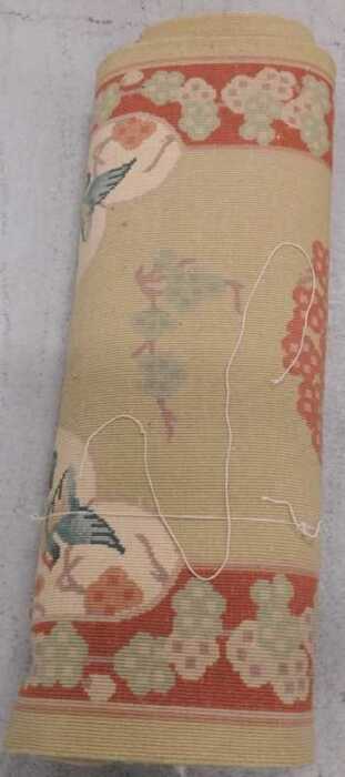 A machine woven rug.