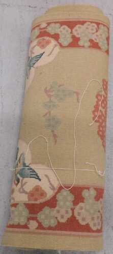 A machine woven rug.