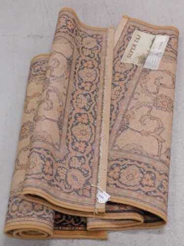 A Super Taj machine woven rug, and another.