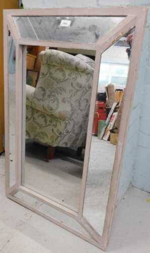 A rectangular hanging mirror.