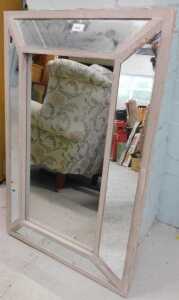 A rectangular hanging mirror.