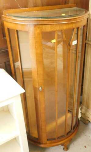 A mid 20thC oak D end display cabinet.