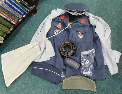 A 20thC German Luftwaffe replica uniform, in blue, comprising jacket, trousers, forage and...