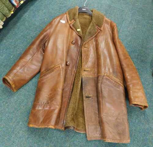 A gentleman's brown leather jacket, with woollen lining, size unknown.