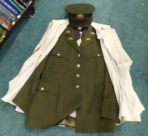 A late US Army officer's uniform, with Van Heusen label, peak cap, shirt and other accessories.