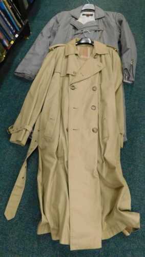 A Burberry style beige three quarter length Macintosh style coat, and another in grey, size...