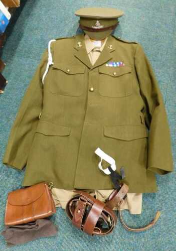A British Army Major uniform, to include jacket with brass buttons, marked size 45, with a peak...