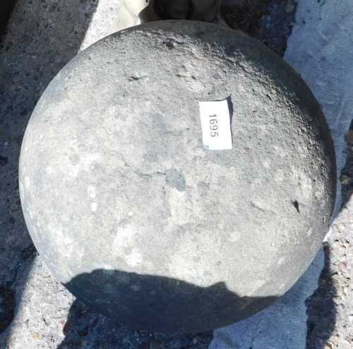 A concrete garden orb finial.