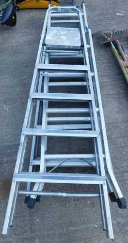 Various metal folding step ladders.