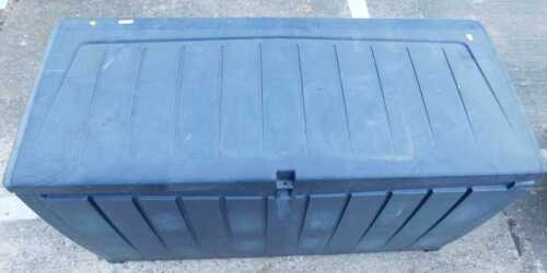 A plastic slatted garden storage box, of oblong form.