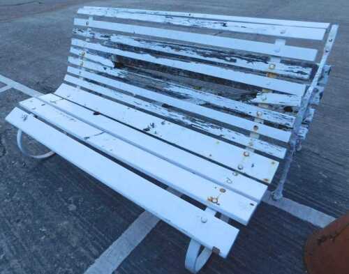 An early 20thC iron framed Coalbrookdale style bench, with part wooden slatted back, on shaped...