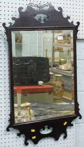 A Chippendale design fret mirror, probably early 20thC, with urn and scroll outline and bevelled...