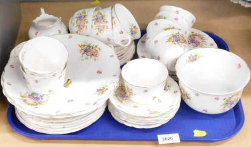 A Royal Doulton floral pattern part tea service, to include serving pieces, slop bowl, cups,...