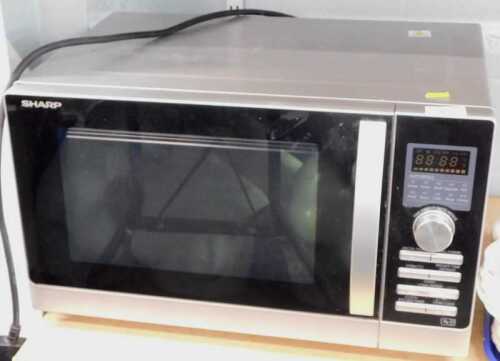 A Sharp Auto Menu kitchen microwave oven.