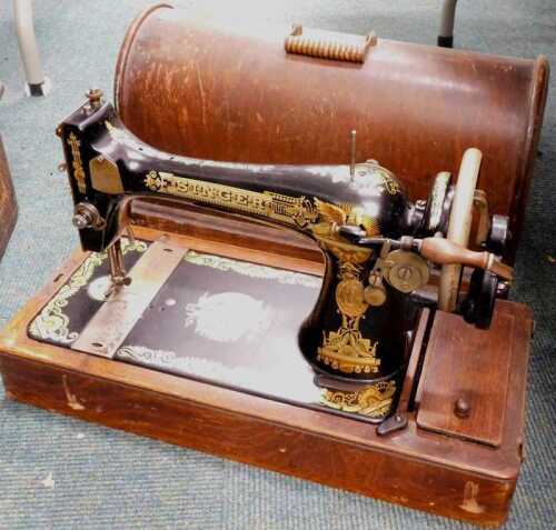 A wood cased Singer sewing machine.