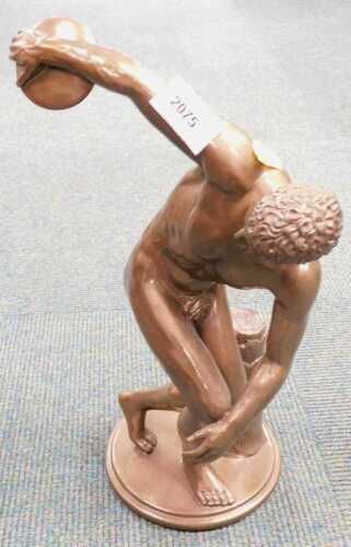 A resin cast figure of a nude male with discus.