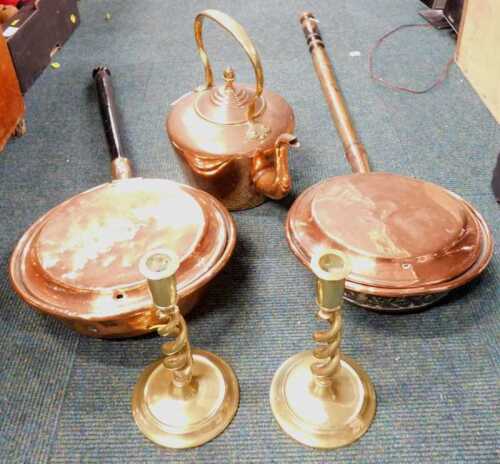 A copper warming pan, with wooden handle, together with a pair of brass twisted stem...