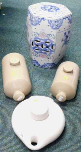 A modern pierced ceramic oriental hexagonal stool, together with various stoneware hot water...