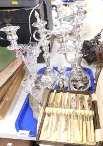 Platedware, candelabra, napkin rings, cruet sets, butler hook, and a cased set of fish knives...