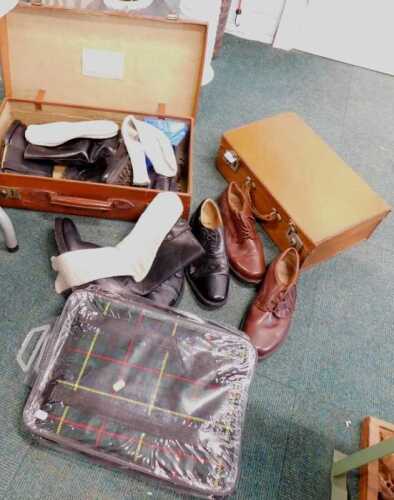 A tartan picnic blanket, together with two leather suitcases, men's shoes, socks, etc.