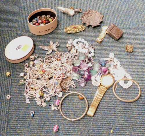 A group of assorted costume jewellery, to include imitation charm bracelets, various links,...