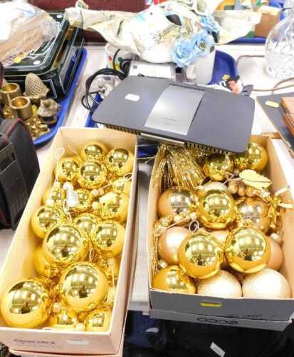 Christmas decorations, consisting of baubles, together with a Linksys wi-fi router, together...