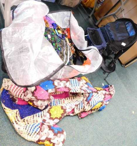 A quantity of patterned material, together with camera cases, camera rucksack. (contents under 1...