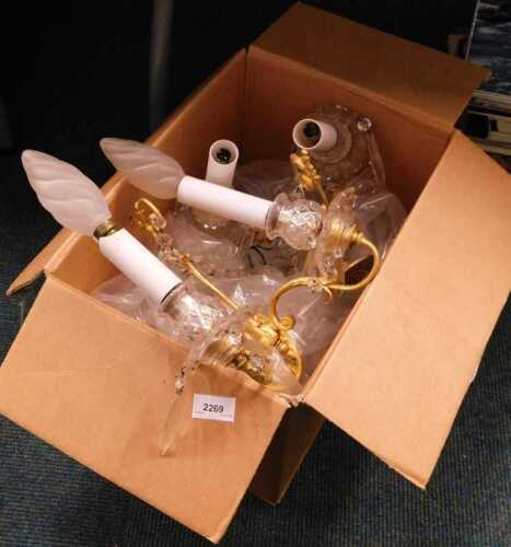 V - A pair of chandelier type ceiling light fittings, with glass and brass detail. Note: VAT is...