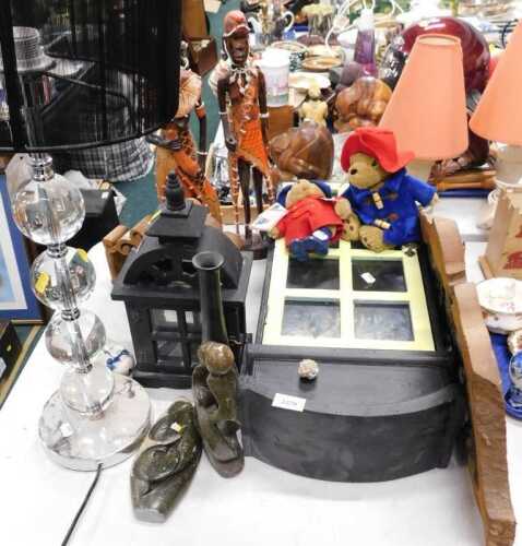 Two Paddington Bear soft toys, together with two tribal figures, small black display box with...