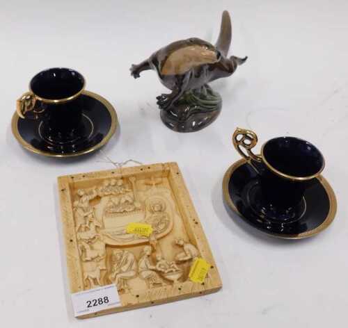 A Charm of Creamware model of an otter, together with a pair of Limoges cups and saucers, an...