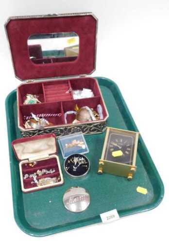 A cast metal jewellery box containing costume jewellery, necklaces, brooches, badges, etc.,...