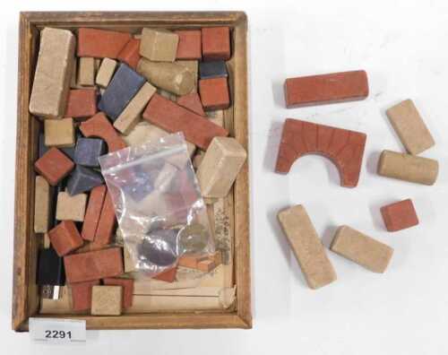 A set of early 20thC ceramic child's building blocks, together with various tokens, including...