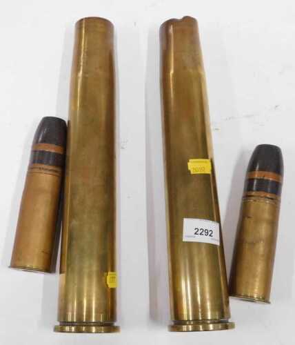 A pair of 1955 dated 40mm Mk 4 Bofors brass inert shell cases, together with two 1903 37mm...