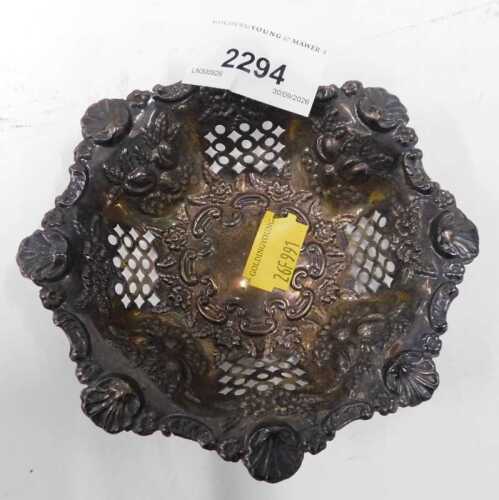 A small silver plate pin dish, embossed with fruit and flowers.