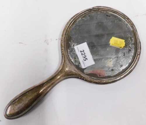 A Victorian silver hand mirror. (AF)