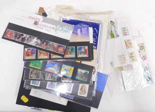 World stamps, three albums, plus special issue packs for stamps. (1 tray)