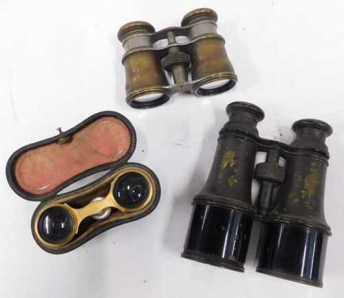 A pair of brass bodied binoculars, with nickel plated slides, marked Property of the...