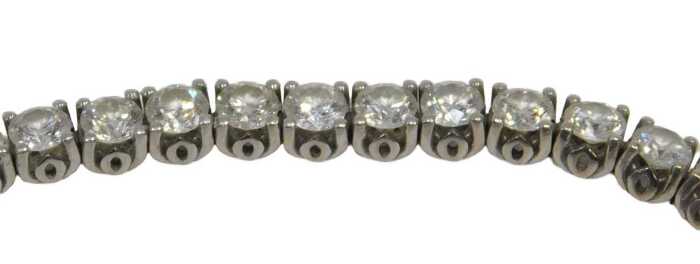 A diamond Protea tennis bracelet, set with forty five round brilliant cut diamonds, totalling...