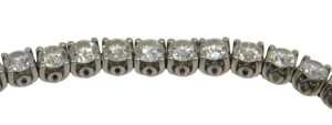 A diamond Protea tennis bracelet, set with forty five round brilliant cut diamonds, totalling...