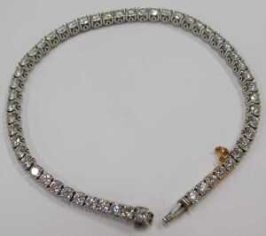 A diamond Protea tennis bracelet, set with forty five round brilliant cut diamonds, totalling... - 3