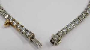 A diamond Protea tennis bracelet, set with forty five round brilliant cut diamonds, totalling... - 4