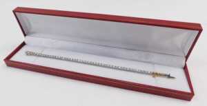 A diamond Protea tennis bracelet, set with forty five round brilliant cut diamonds, totalling... - 5