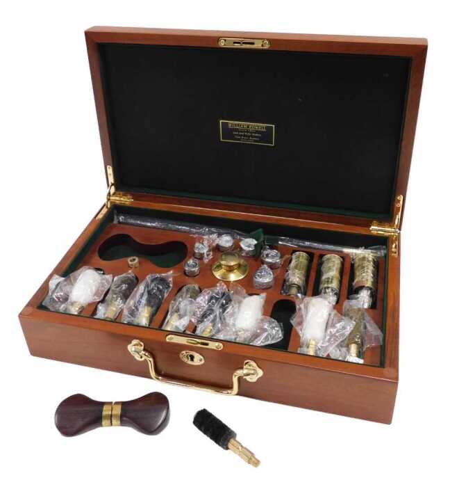 A late 20thC William Powell Gun & Rifle Makers gun cleaning kit, in a mahogany case of...