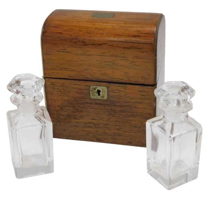 A 19thC rosewood travelling perfume bottle case, of domed form, with gilt metal mounts and plain...