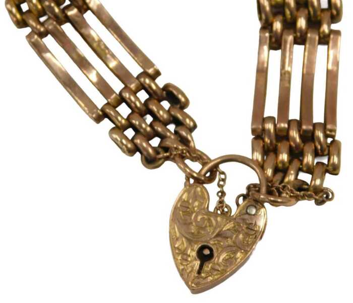 A 9ct gold gate bracelet, with heart shaped clasp, marked 9ct, and engraved Edna M Townhill...