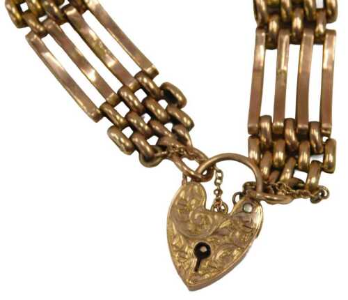 A 9ct gold gate bracelet, with heart shaped clasp, marked 9ct, and engraved Edna M Townhill...
