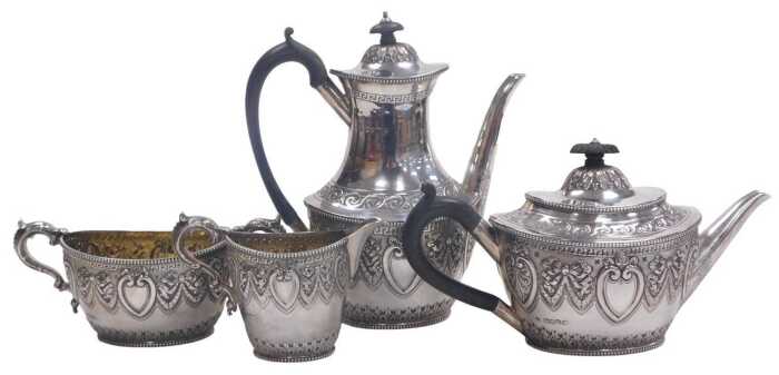 A Victorian silver four piece tea and coffee service, embossed with acanthus leaves, bow tied...