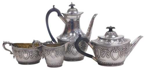 A Victorian silver four piece tea and coffee service, embossed with acanthus leaves, bow tied...